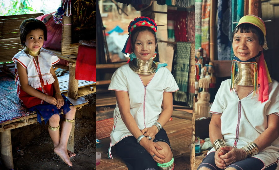 Donne e bambine Karen Padaung rappresentano le generazioni nel villaggio tradizionale in Thailandia